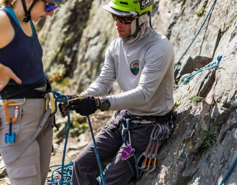A couple gearing up to go rock climbing as part of their rafting package.
